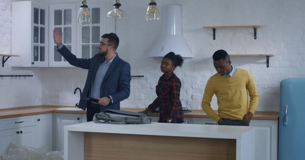 Real estate agent showing property to a couple